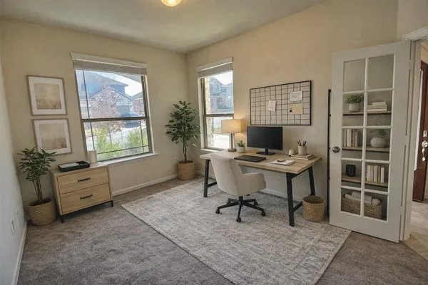 a workspace with furniture and a window
