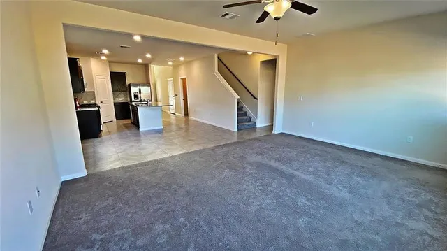 a view of a livingroom with a kitchen