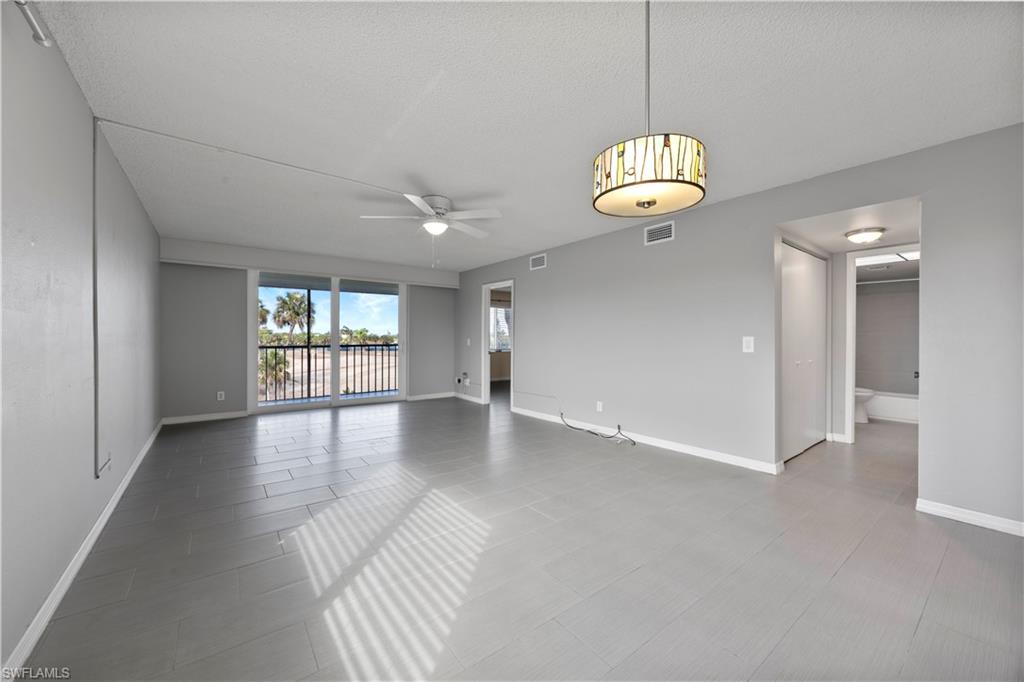 4372 27th Court Southwest, Unit 301 Naples, FL 34116 - Photo 17 of 37 a view of an empty room with a window