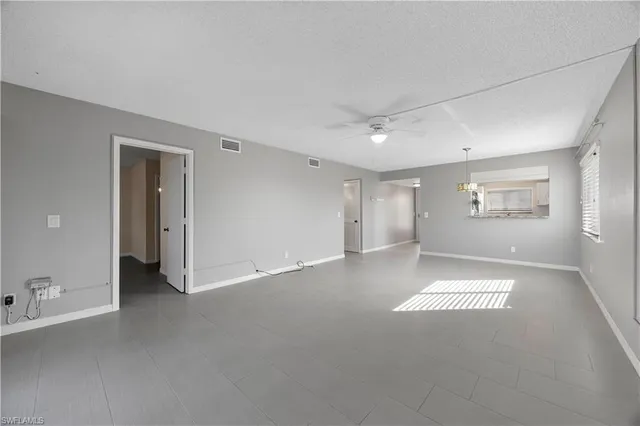 a view of an empty room with a window