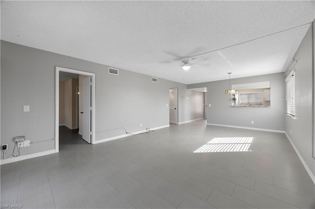 4372 27th Court Southwest, Unit 301 Naples, FL 34116 - Photo 18 of 37 a view of an empty room with a window
