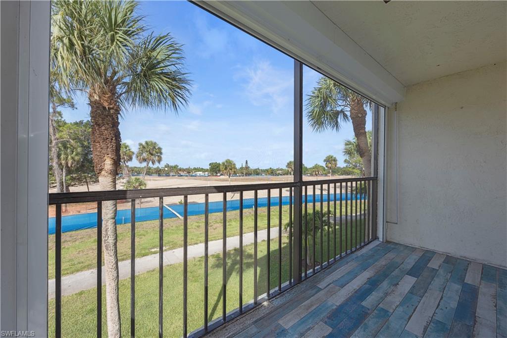 4372 27th Court Southwest, Unit 301 Naples, FL 34116 - Photo 20 of 37 a view of a large window with wooden floor