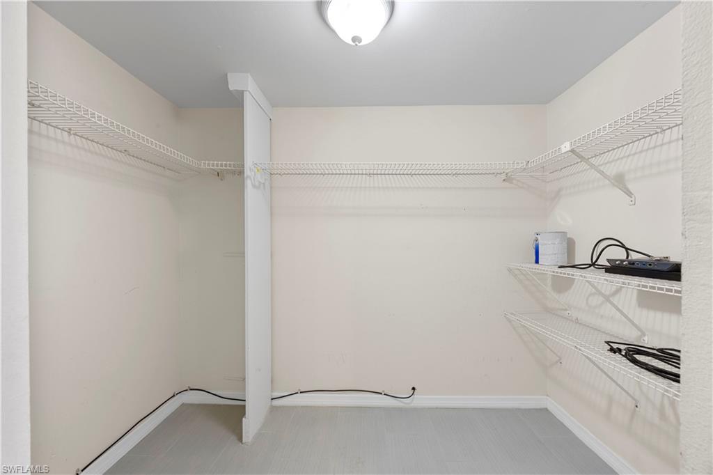 4372 27th Court Southwest, Unit 301 Naples, FL 34116 - Photo 25 of 37 a view of walk in closet