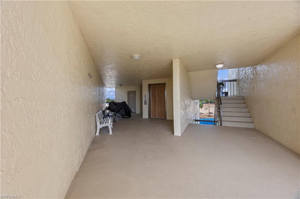 4372 27th Court Southwest, Unit 301 Naples, FL 34116 - Photo 28 of 37 a view of a livingroom with furniture and a rug