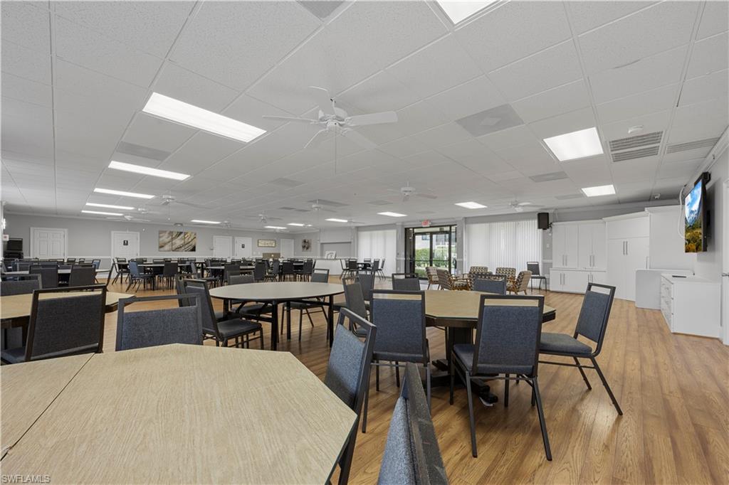 4372 27th Court Southwest, Unit 301 Naples, FL 34116 - Photo 37 of 37 a view of a dining room with furniture