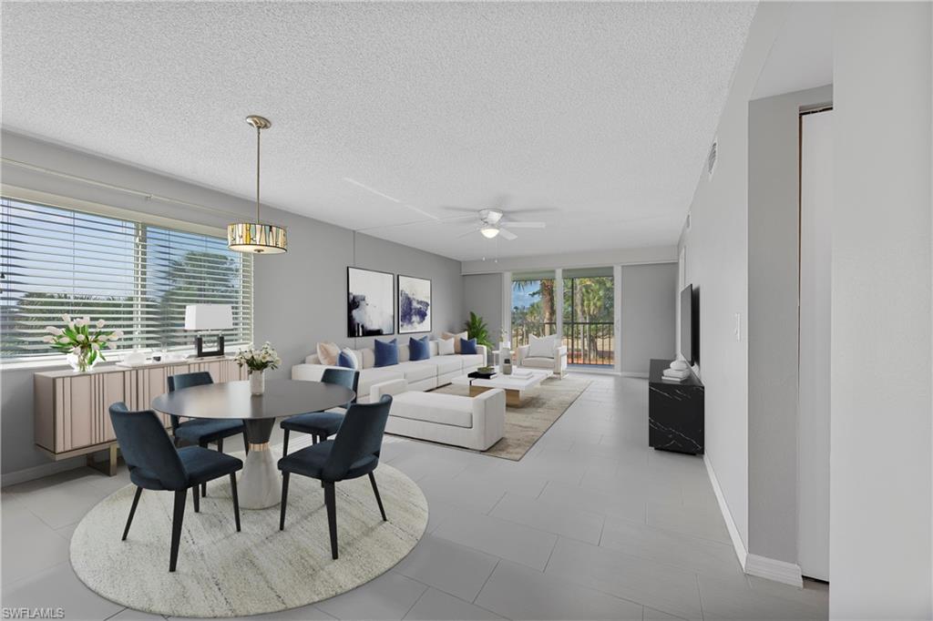 4372 27th Court Southwest, Unit 301 Naples, FL 34116 - Photo 4 of 37 a view of a dining room with furniture window and outside view