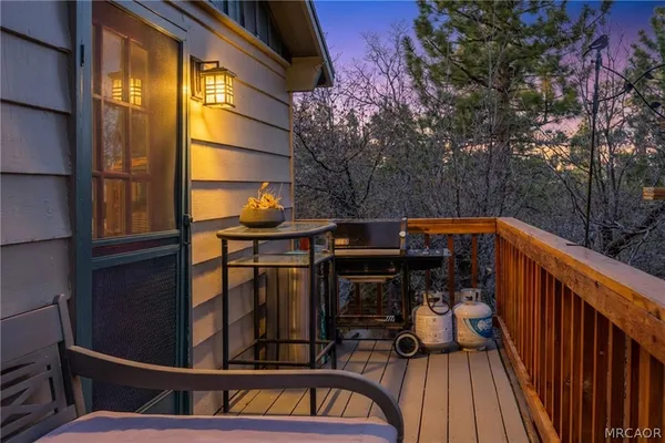 a view of outdoor space with deck and flat screen tv