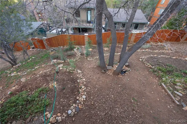 a view of yard with swimming pool