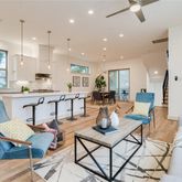 a dining room with furniture a window and a chandelier