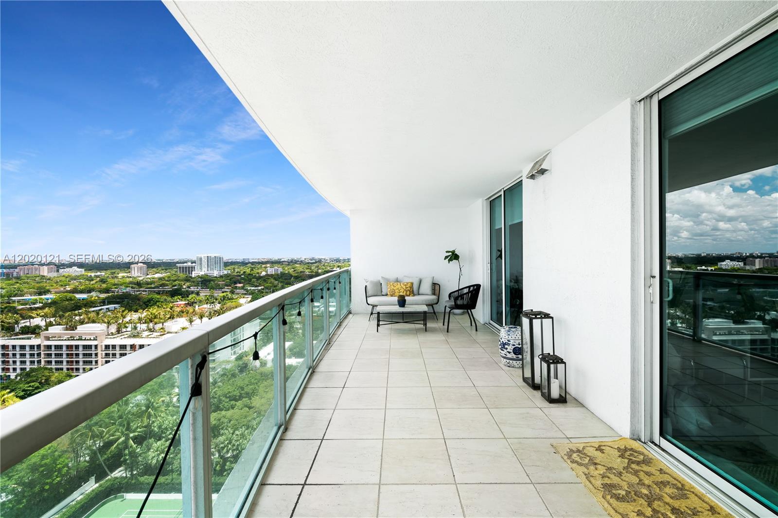 2101 Brickell Avenue, Unit 1909 Miami, FL 33129 - Photo 20 of 25 a terrace with outdoor seating and city view