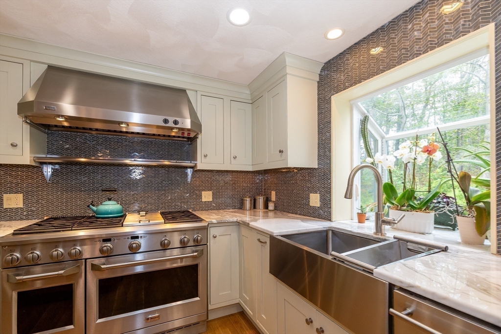 759 Main Street Boxford, MA 01921 - Photo 12 of 35 a kitchen with a stove a sink and a microwave
