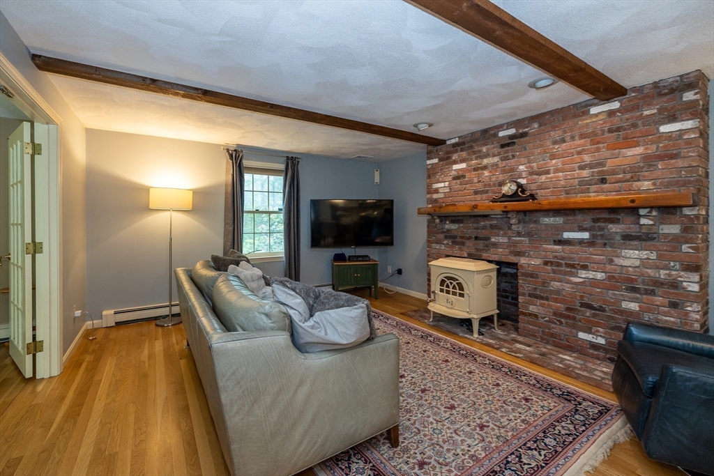 759 Main Street Boxford, MA 01921 - Photo 15 of 35 a living room with furniture and a flat screen tv