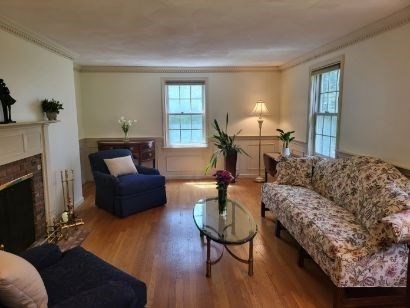 759 Main Street Boxford, MA 01921 - Photo 18 of 35 a living room with furniture and a fireplace