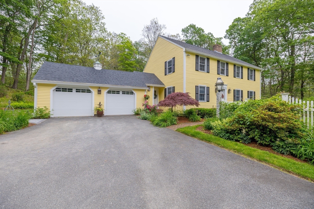 759 Main Street Boxford, MA 01921 - Photo 2 of 35 a view of a white house with a yard and plants