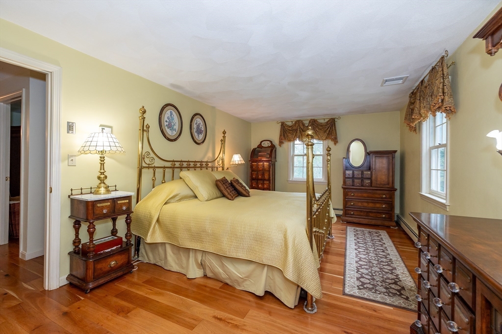 759 Main Street Boxford, MA 01921 - Photo 21 of 35 a bedroom with a bed and wooden floor