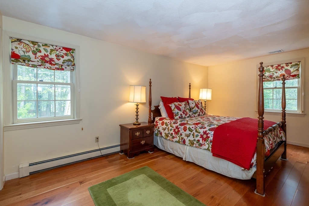 759 Main Street Boxford, MA 01921 - Photo 22 of 35 a bed room with a bed and a chair