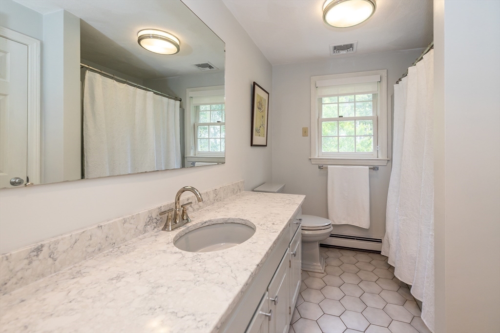 759 Main Street Boxford, MA 01921 - Photo 25 of 35 a bathroom with a sink toilet and mirror