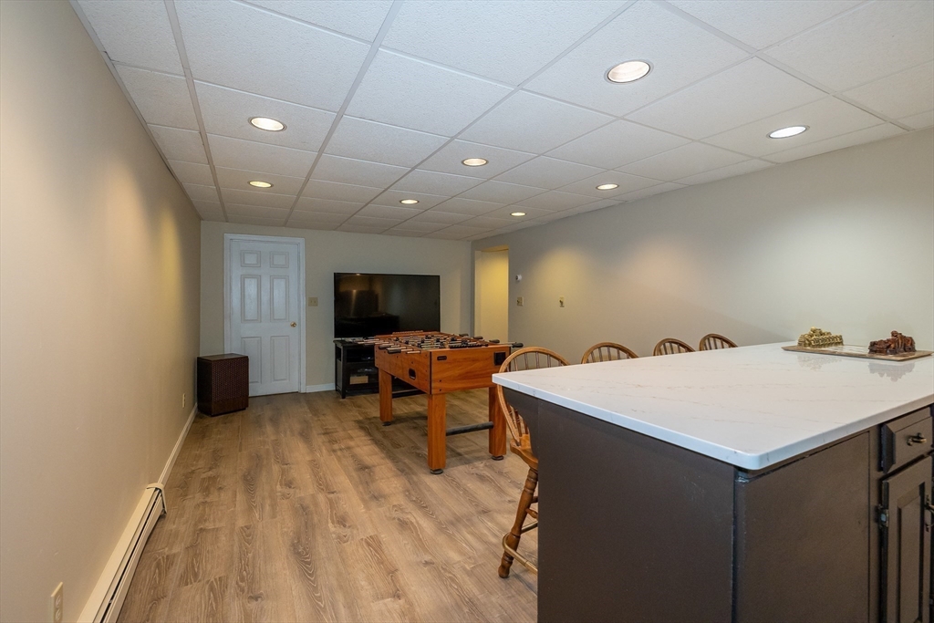 759 Main Street Boxford, MA 01921 - Photo 30 of 35 a room with furniture a flat screen tv and a large window