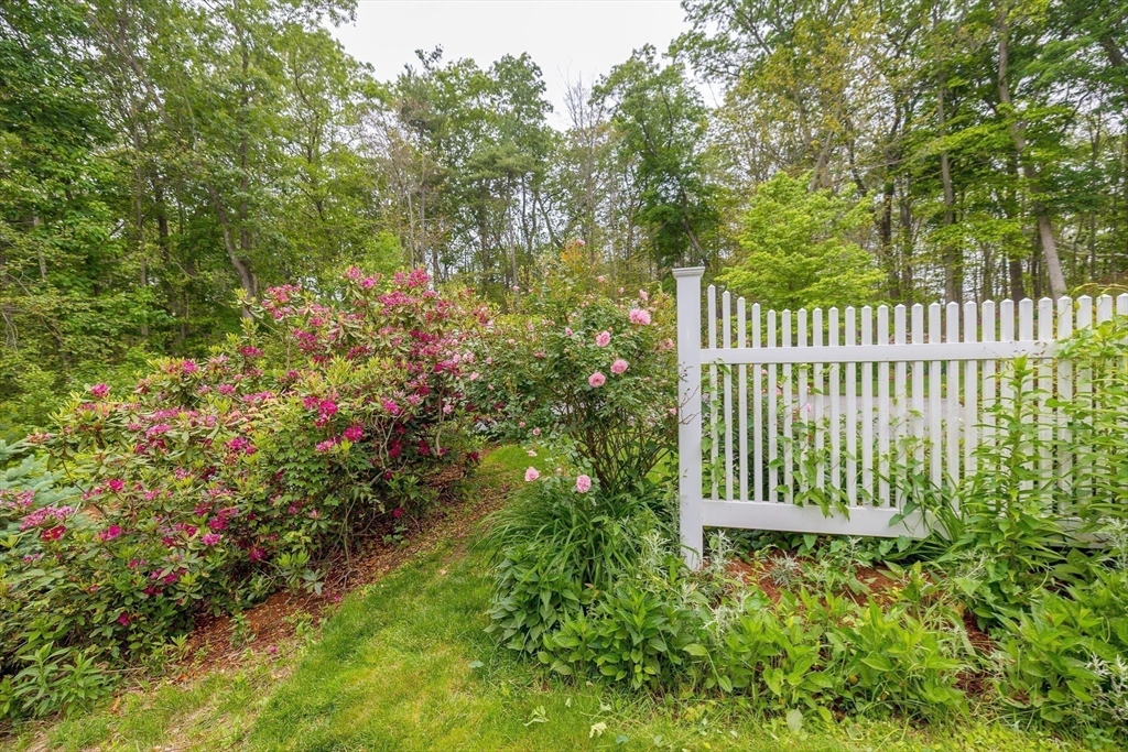 759 Main Street Boxford, MA 01921 - Photo 35 of 35 a view of a house with a small yard and wooden fence