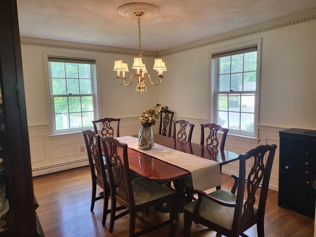 759 Main Street Boxford, MA 01921 - Photo 6 of 35 a view of a dining room with furniture window and wooden floor