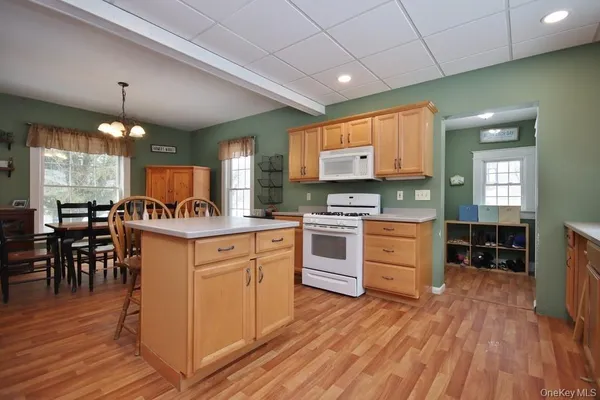 a kitchen with cabinets a sink and appliances