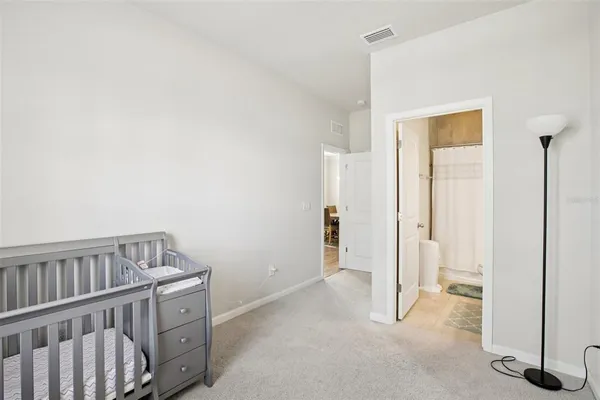 a view of a bedroom with closet area