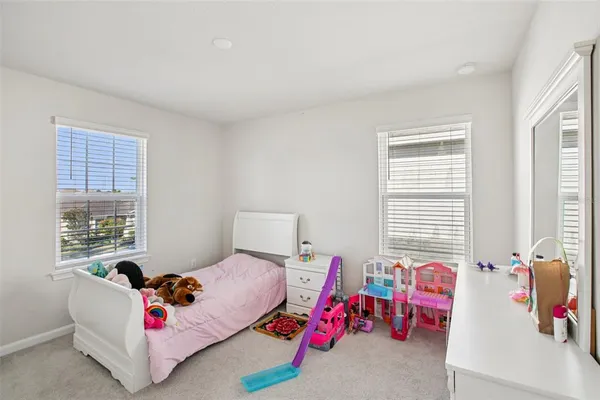 a bedroom with furniture and windows