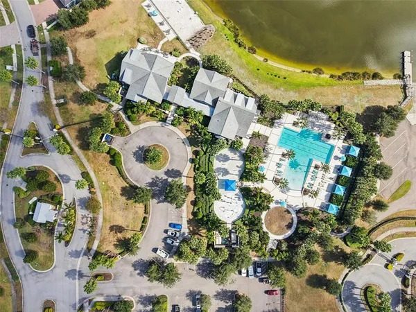 an aerial view of a house with a swimming pool