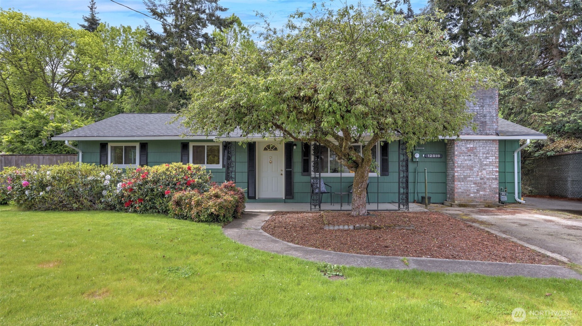 12515 Southeast 171st Street Renton, WA 98058 - Photo 1 of 24 a front view of a house with a yard and porch
