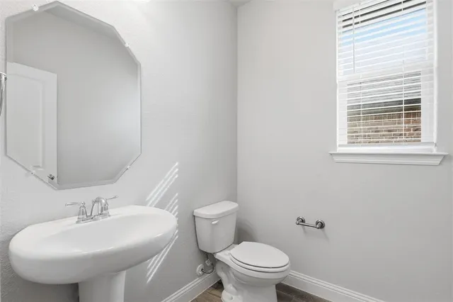 a kitchen with a sink stainless steel appliances and cabinets