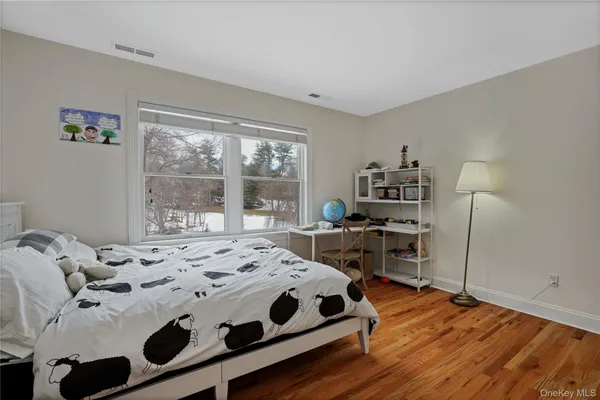 a bedroom with a bed and a table in it