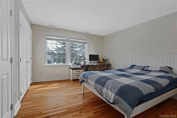 a bed room with a bed and a window