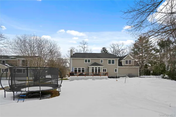 a view of a house with a snow in the background