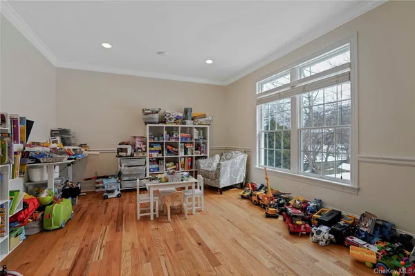 a room with wooden floor and a window
