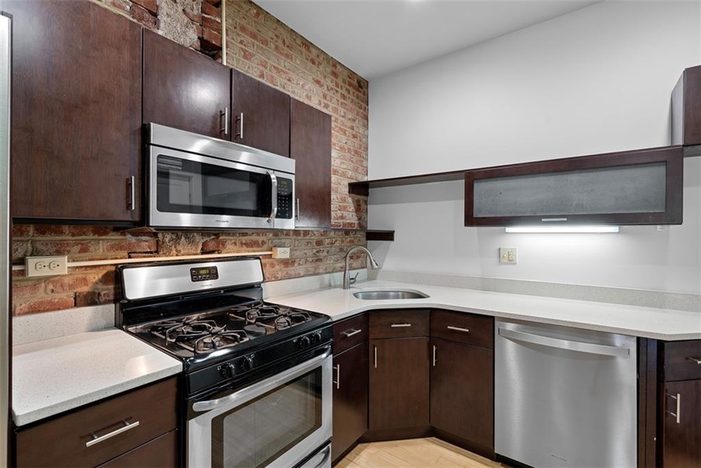 1402 James Street Pittsburgh, PA 15212 - Photo 12 of 30 a kitchen with a stove and a microwave