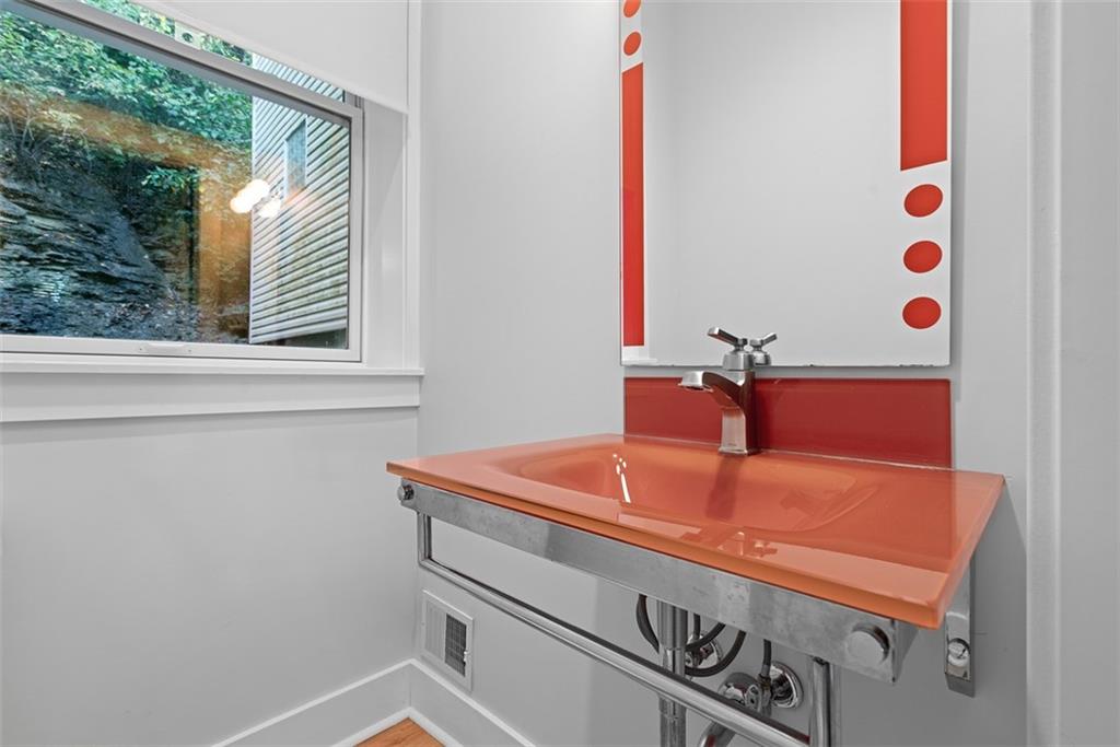 1402 James Street Pittsburgh, PA 15212 - Photo 16 of 30 a bathroom with a sink and a mirror