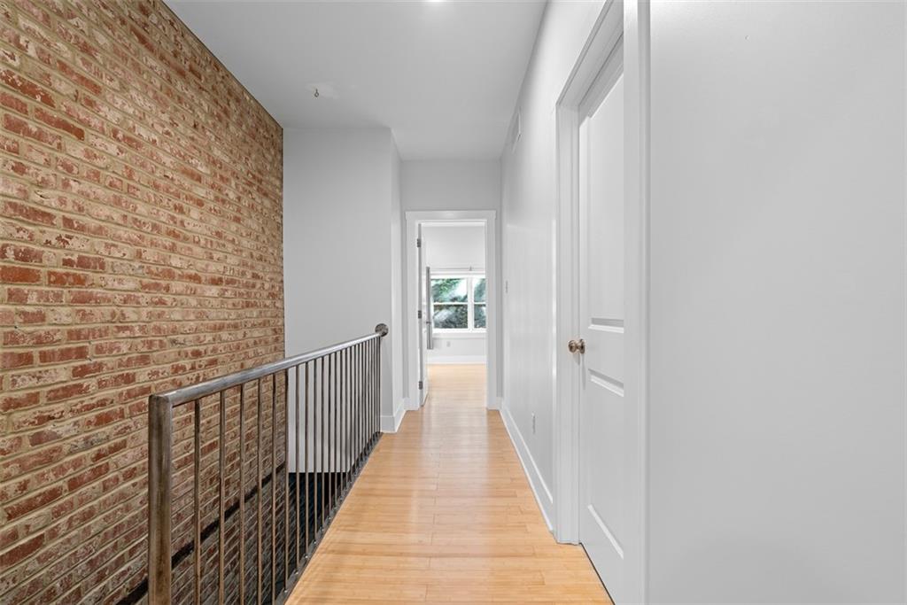 1402 James Street Pittsburgh, PA 15212 - Photo 17 of 30 a view of a hallway with wooden floor and staircase
