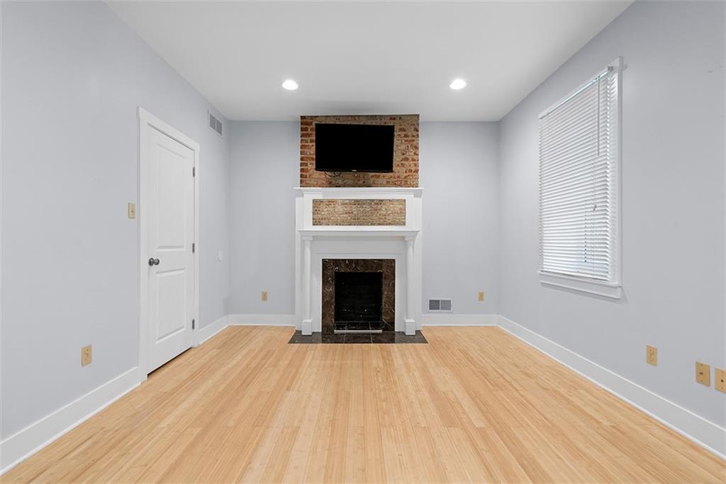 1402 James Street Pittsburgh, PA 15212 - Photo 18 of 30 a view of an empty room with a fireplace and a window