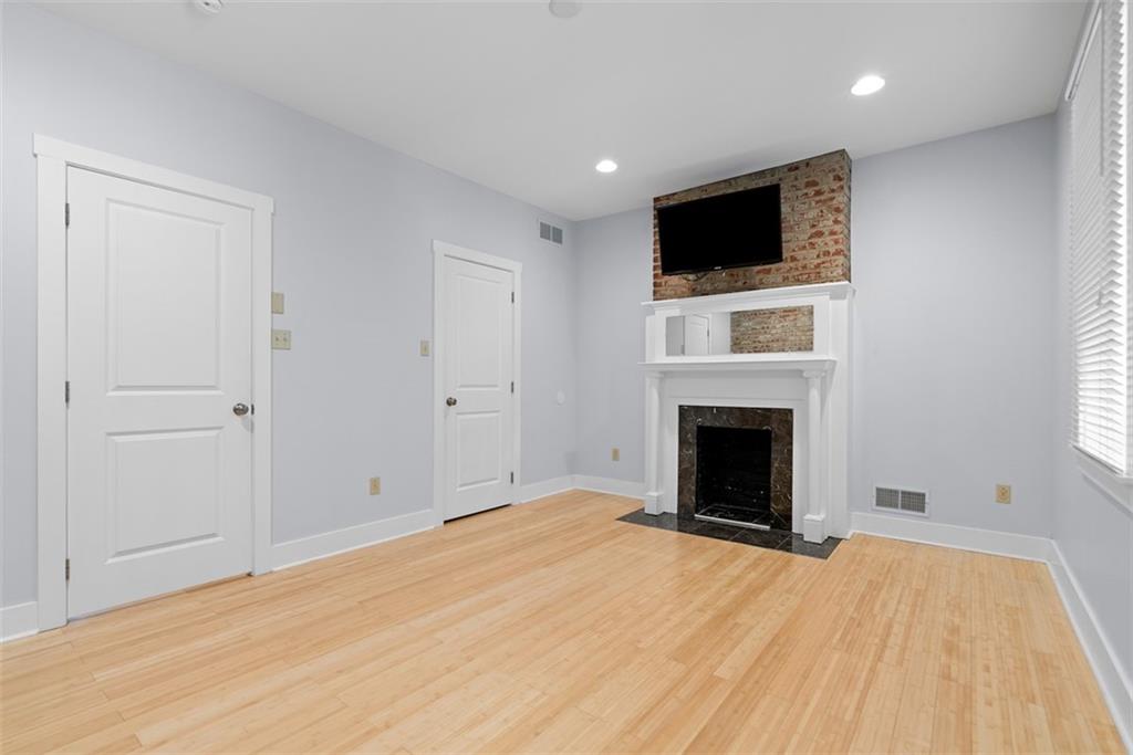 1402 James Street Pittsburgh, PA 15212 - Photo 20 of 30 a view of empty room with a fireplace and flat screen tv