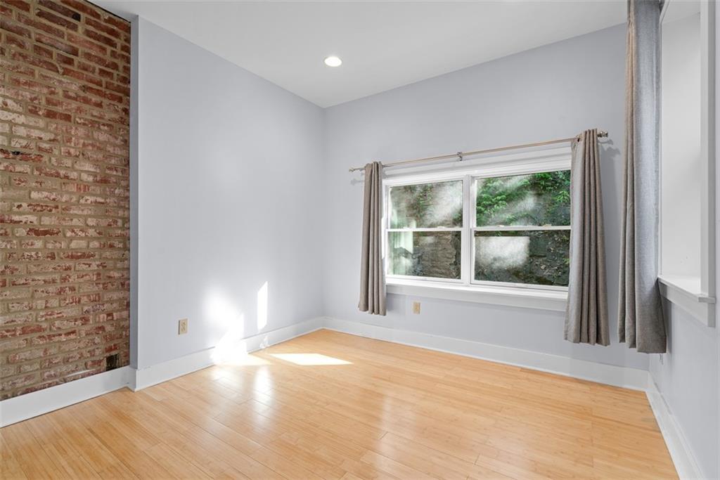 1402 James Street Pittsburgh, PA 15212 - Photo 24 of 30 a view of an empty room with wooden floor and a window