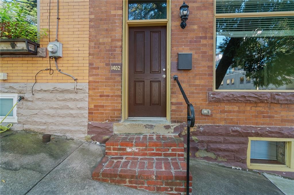1402 James Street Pittsburgh, PA 15212 - Photo 3 of 30 a front view of a house with a yard