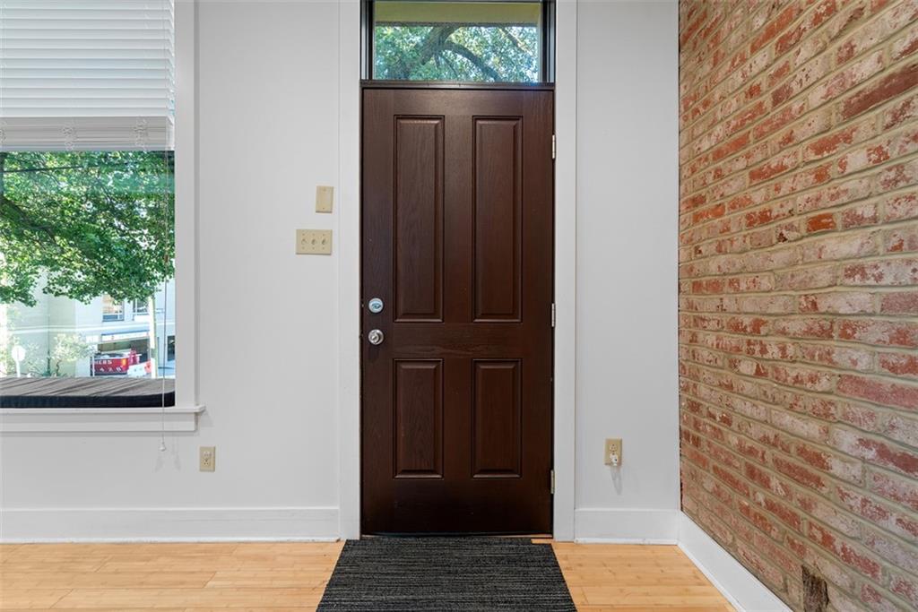 1402 James Street Pittsburgh, PA 15212 - Photo 4 of 30 a view of a hallway with front door and wooden floor