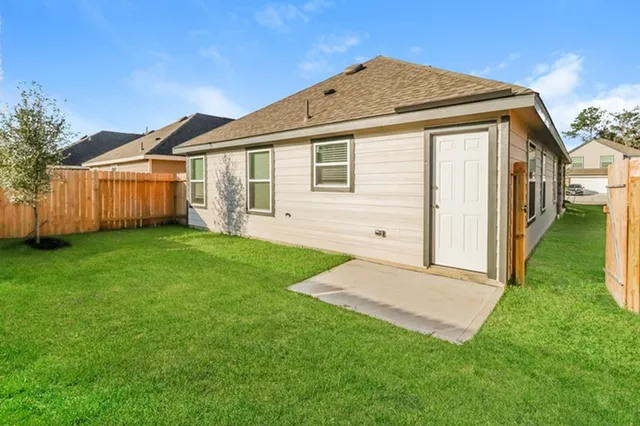 a front view of a house with a yard and porch