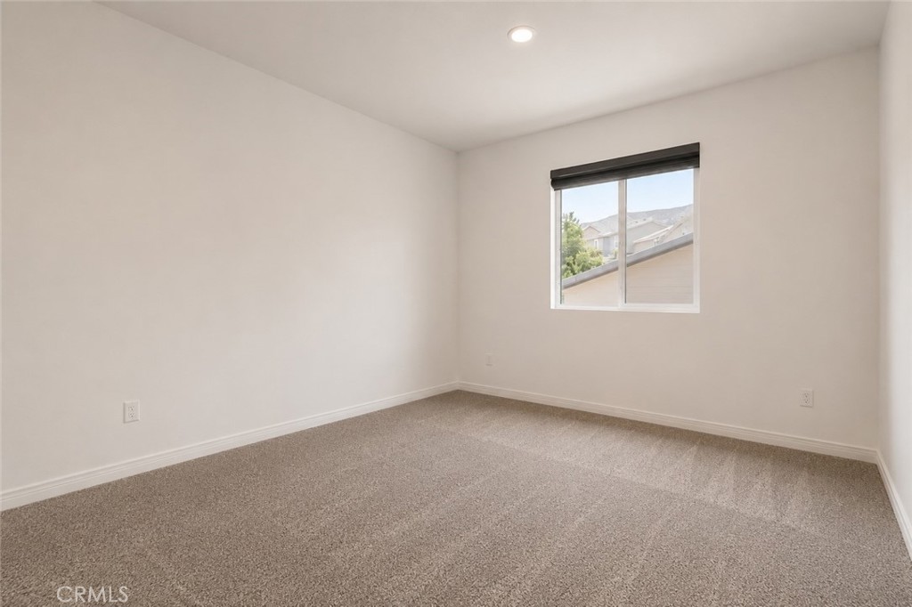 11056 Guffey Ranch Way Corona, CA 92883 - Photo 40 of 61 an empty room with a window
