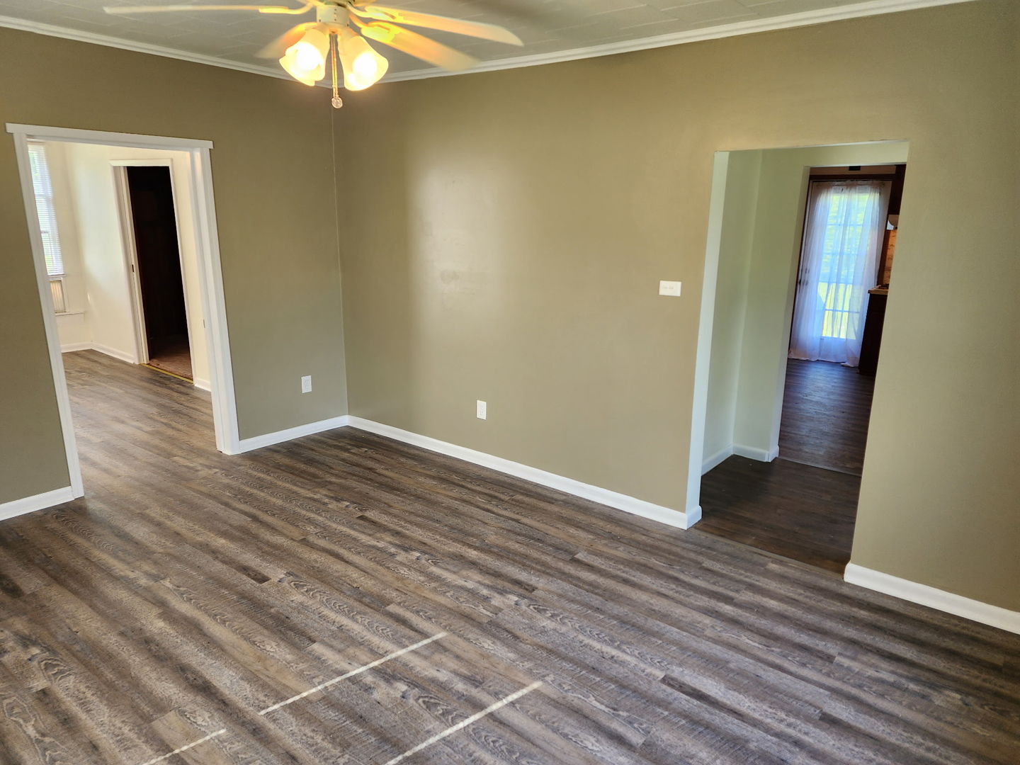 1300 West Madison Street Herrin, IL 62948 - Photo 7 of 14 wooden floor in an empty room with a mirror