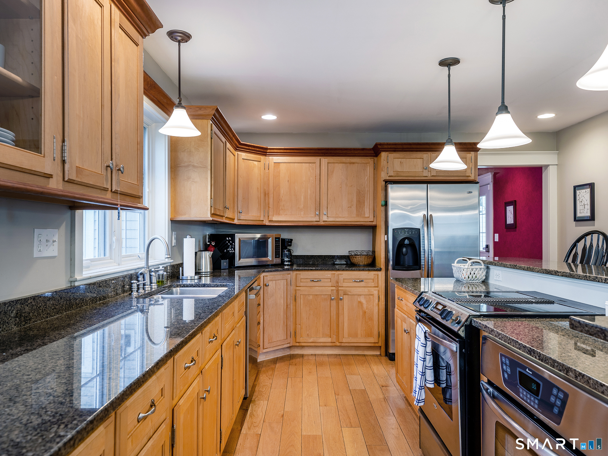 3 Weldon Court Goshen, CT 06756 - Photo 13 of 38 a kitchen with stainless steel appliances granite countertop a sink a stove and a wooden floors