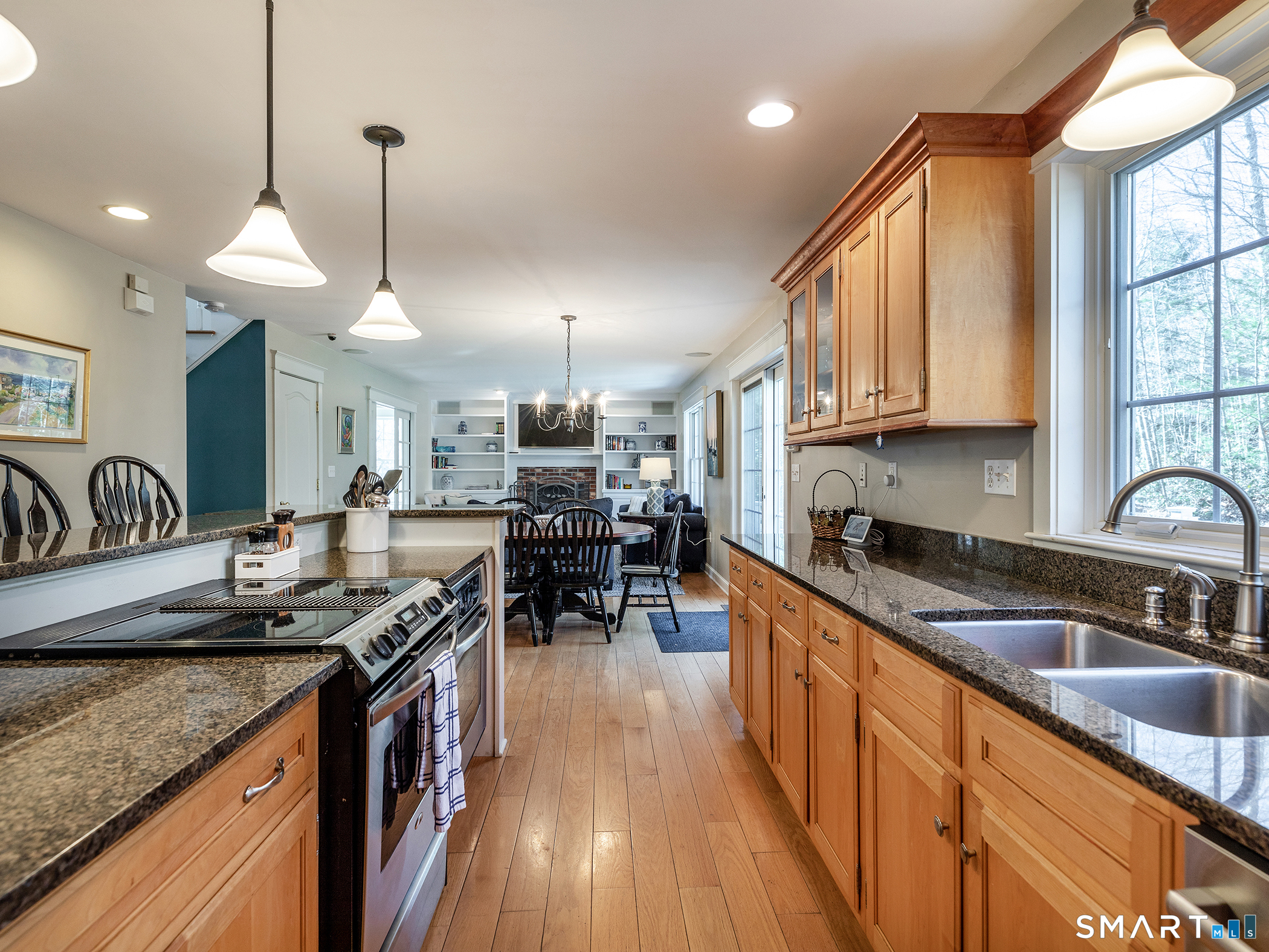 3 Weldon Court Goshen, CT 06756 - Photo 14 of 38 a kitchen with granite countertop a sink a counter top space appliances and cabinets
