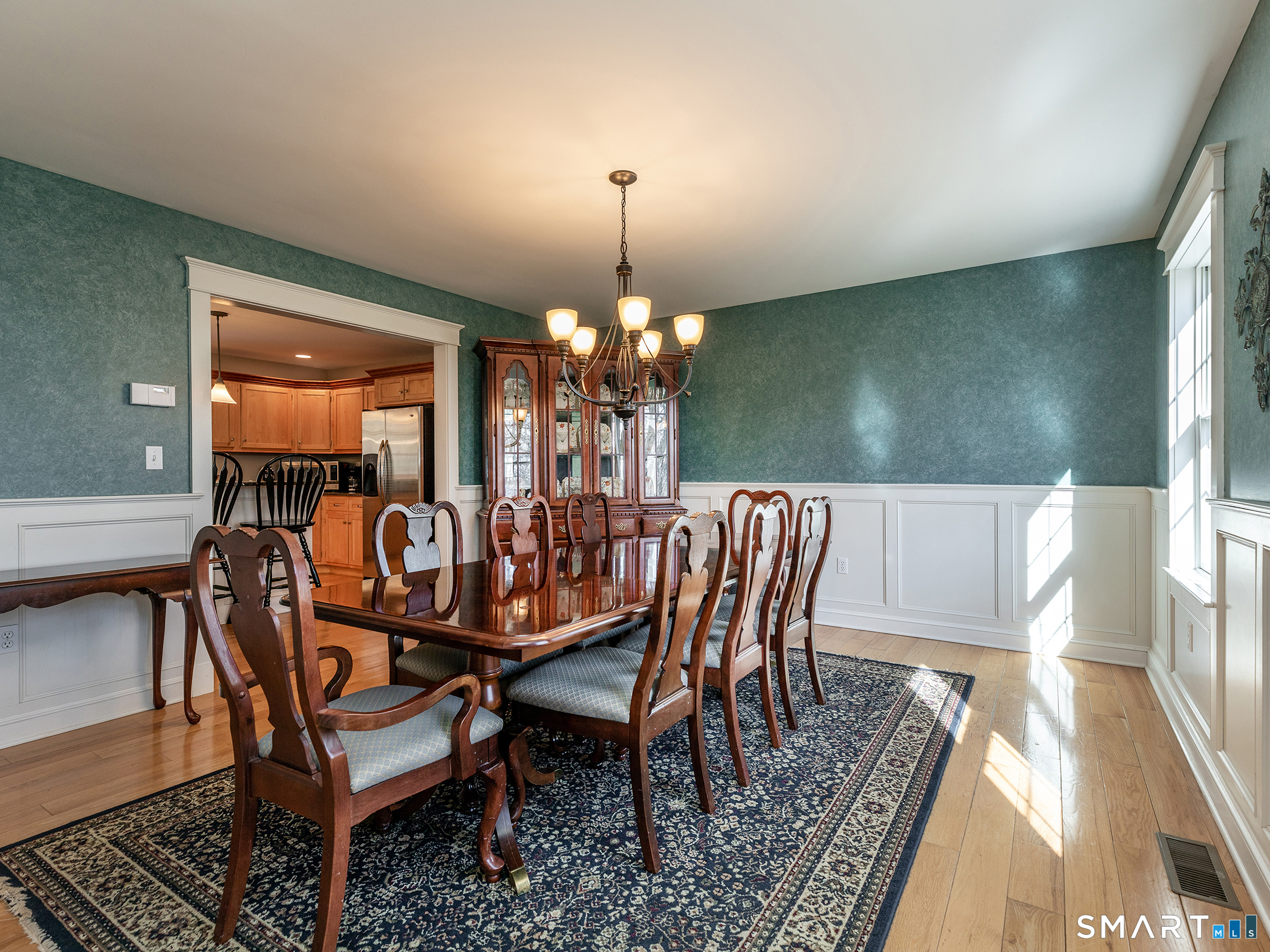3 Weldon Court Goshen, CT 06756 - Photo 15 of 38 a dining room with furniture a chandelier and wooden floor