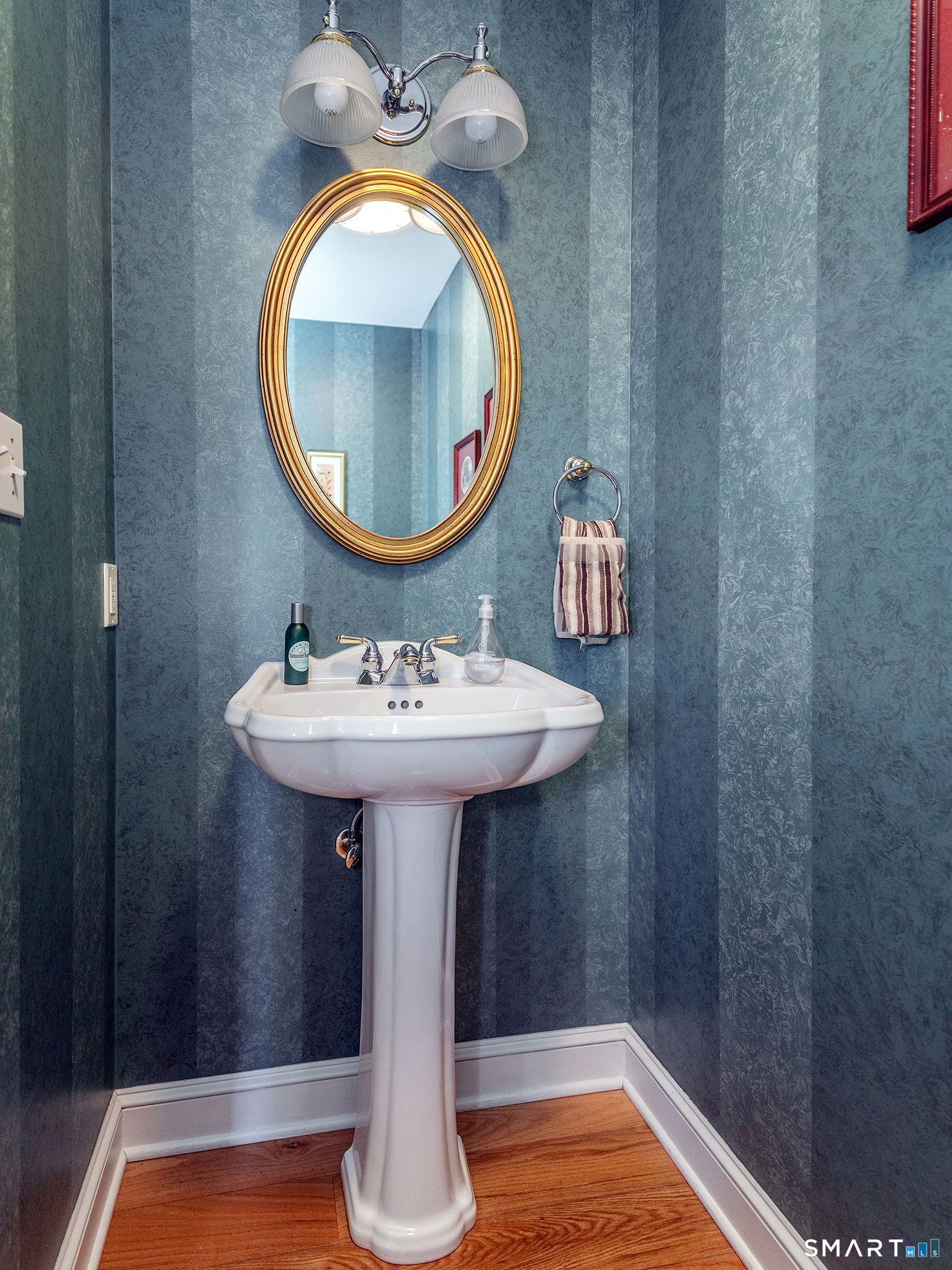 3 Weldon Court Goshen, CT 06756 - Photo 17 of 38 a bathroom with a sink and a mirror