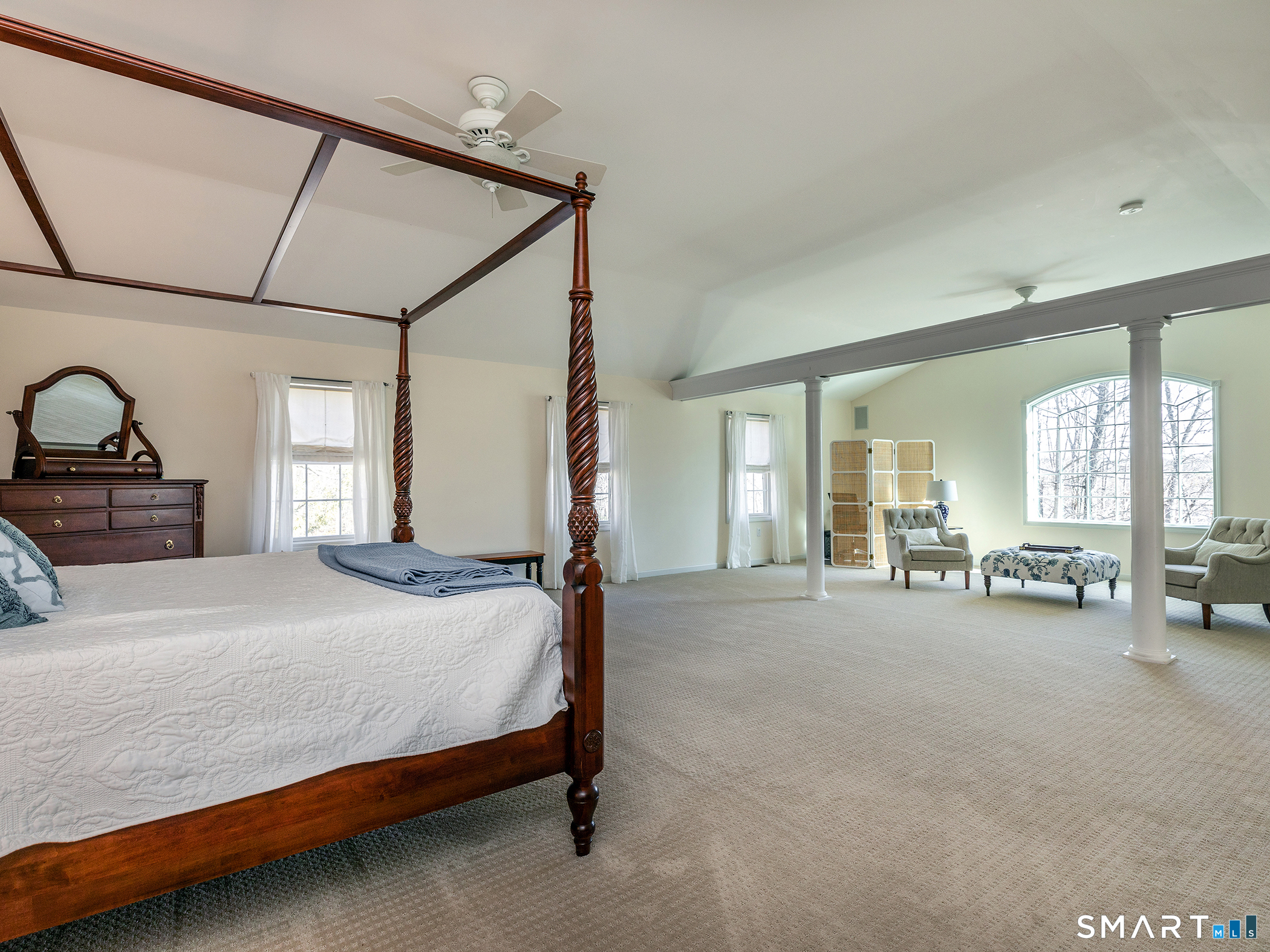 3 Weldon Court Goshen, CT 06756 - Photo 21 of 38 a spacious bedroom with a bed couch and a large window